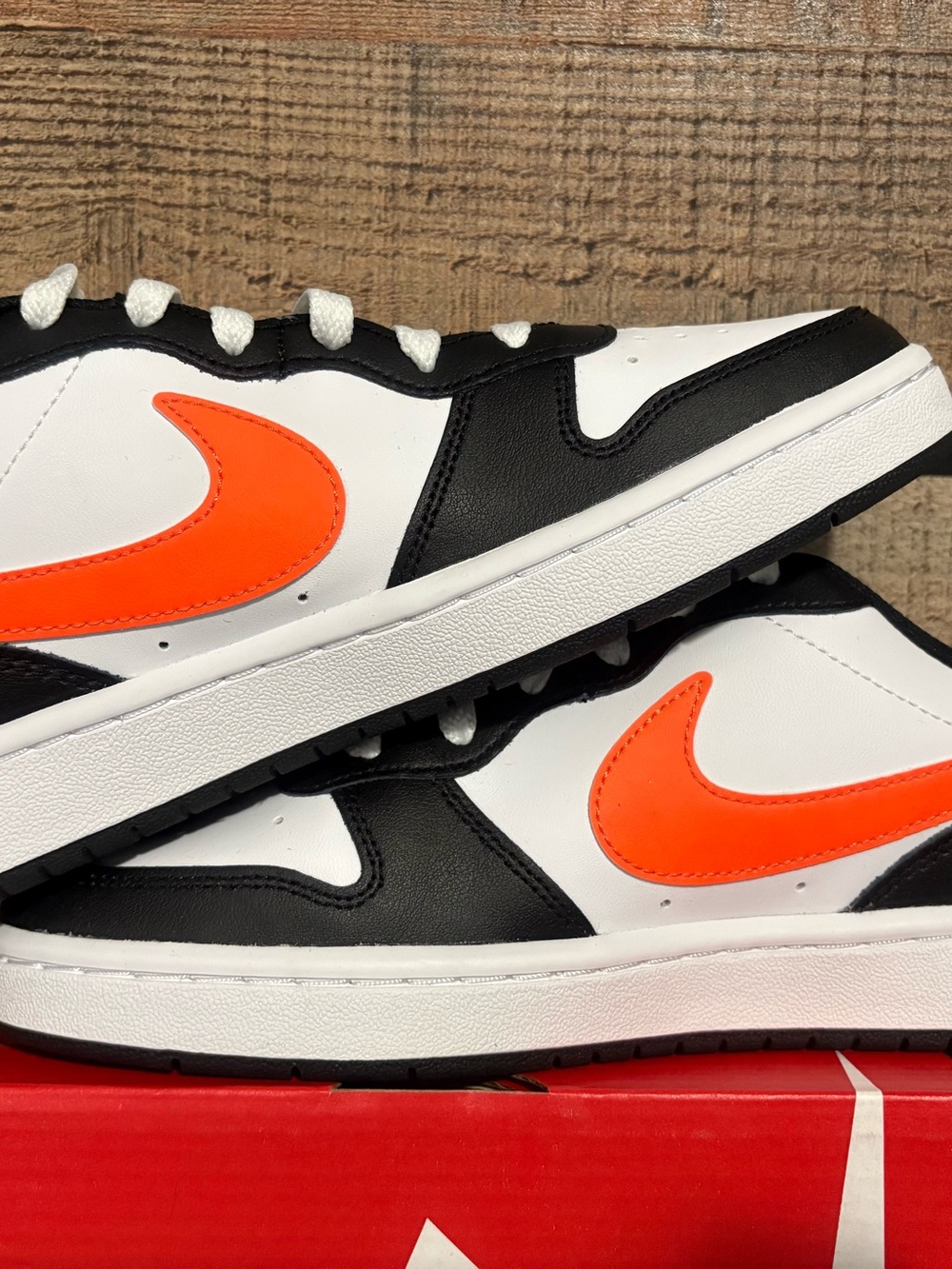 Nike White and Black Low-Top Sneakers with Bright Orange Swoosh